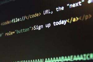 Detailed view of HTML and CSS code on a computer screen, concept of programming.