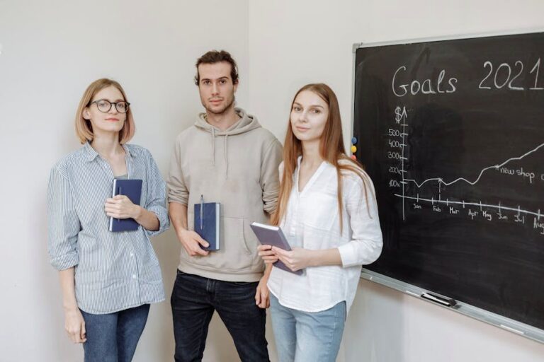 Young professionals brainstorming business strategies for 2021 in an office setting.