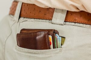 wallet cash pocket credit card money purse leather currency male man belt waistband consumer wealth closeup money money money money money