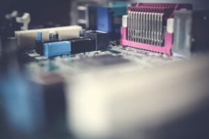Detailed close-up of a circuit board showcasing electronic components in soft focus.