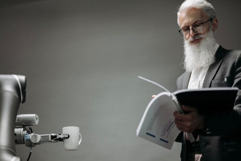 Elderly man reads as a robotic arm holds a coffee cup, showcasing technology integration.