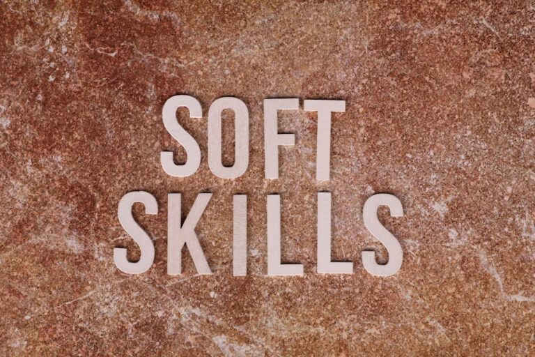 Close-up of the words 'Soft Skills' on a textured stone background for presentations or articles.