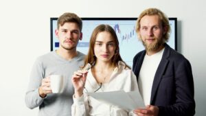 Professional business team discussing financial charts during a meeting in a modern office.