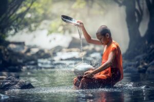 boy monk river buddhist water ritual buddhism meditation culture oriental religion worship sacred spiritual nature thailand asia