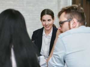 A diverse group of professionals engaging in a collaborative business meeting indoors.