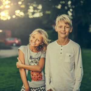 siblings brother sister nature friends boy girl children offspring kids teens teenagers blond relationship relatives two outdoor portrait summer happy smiling smile