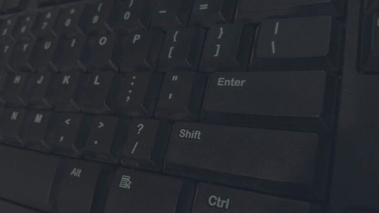 Detailed shot of black computer keyboard showcasing various keys for technology concepts.