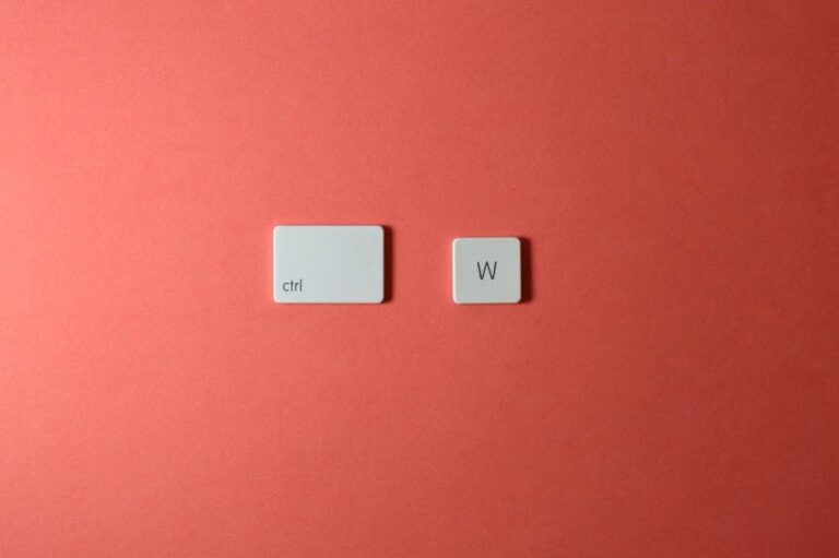 Close-up of Ctrl and W keys on a coral surface showcasing minimalism.